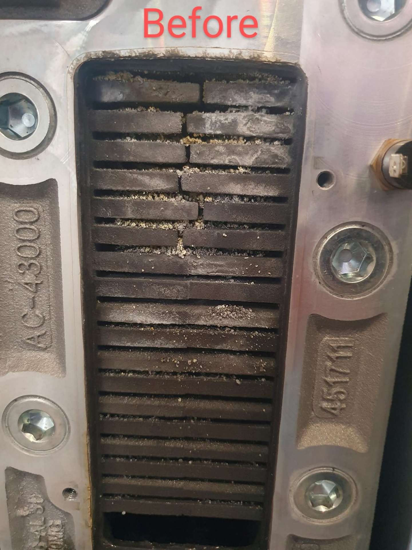 Burner assembly fouled with combustion debris before annual service